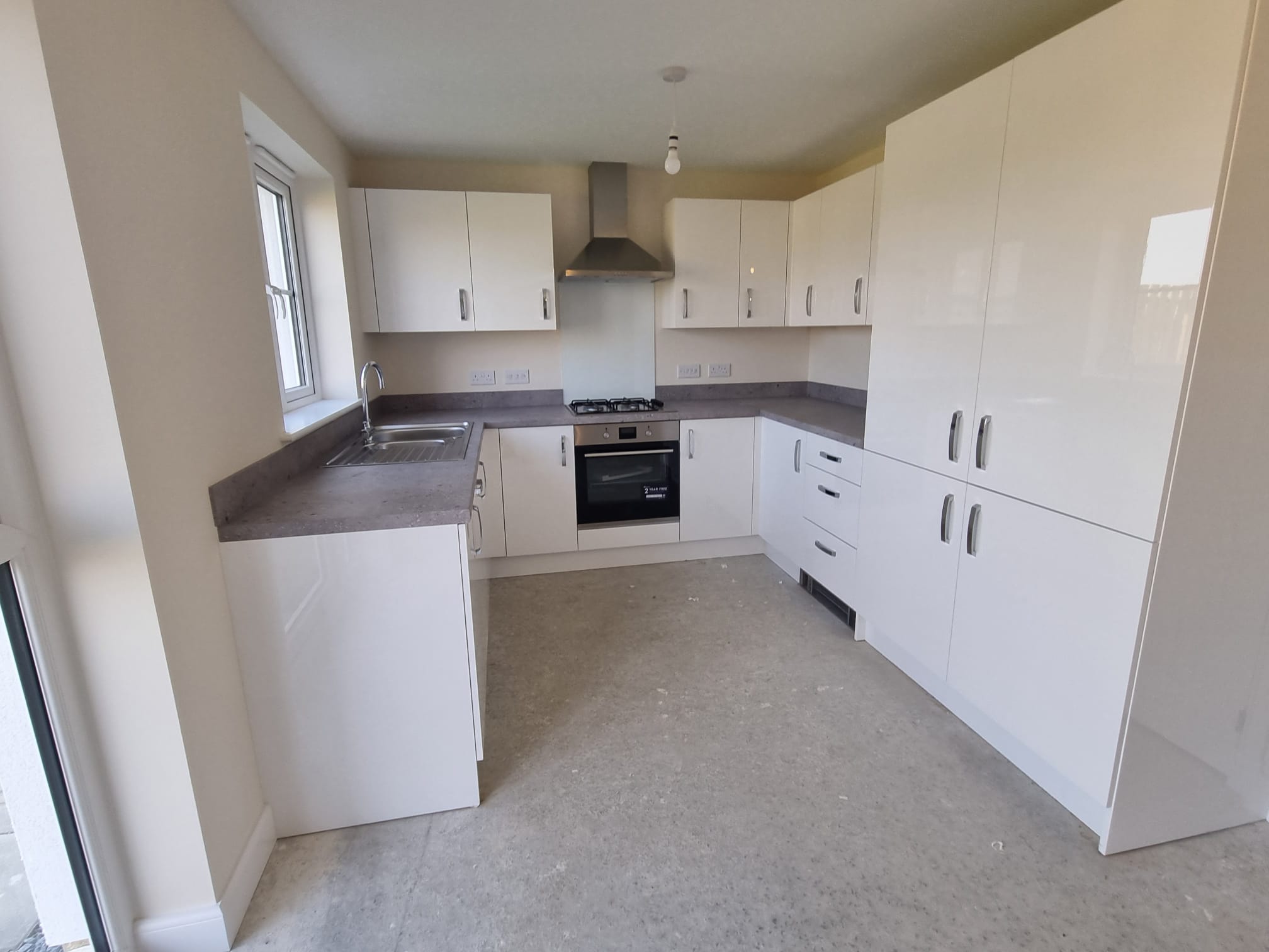 A modern kitchen with a clean, minimalist design
